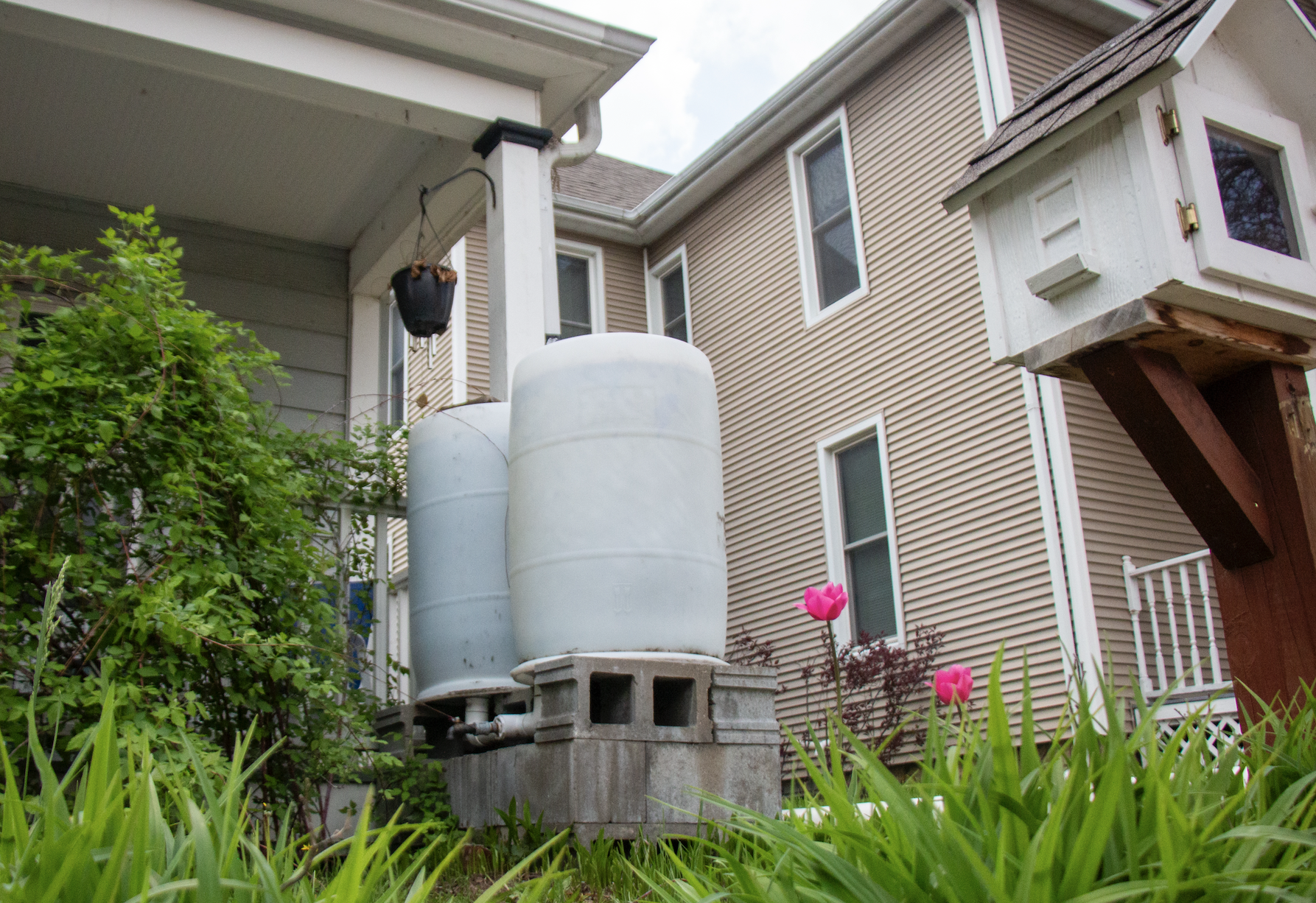 water barrels outside a house