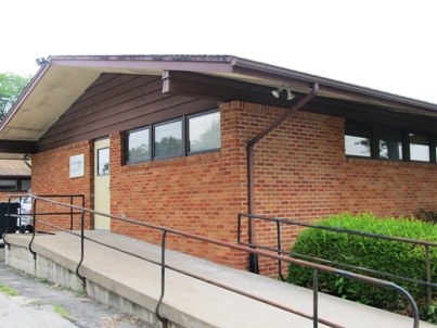 red brick building with an accessibility ramp