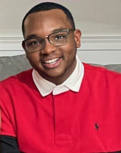 smiling young man in bright red shirt