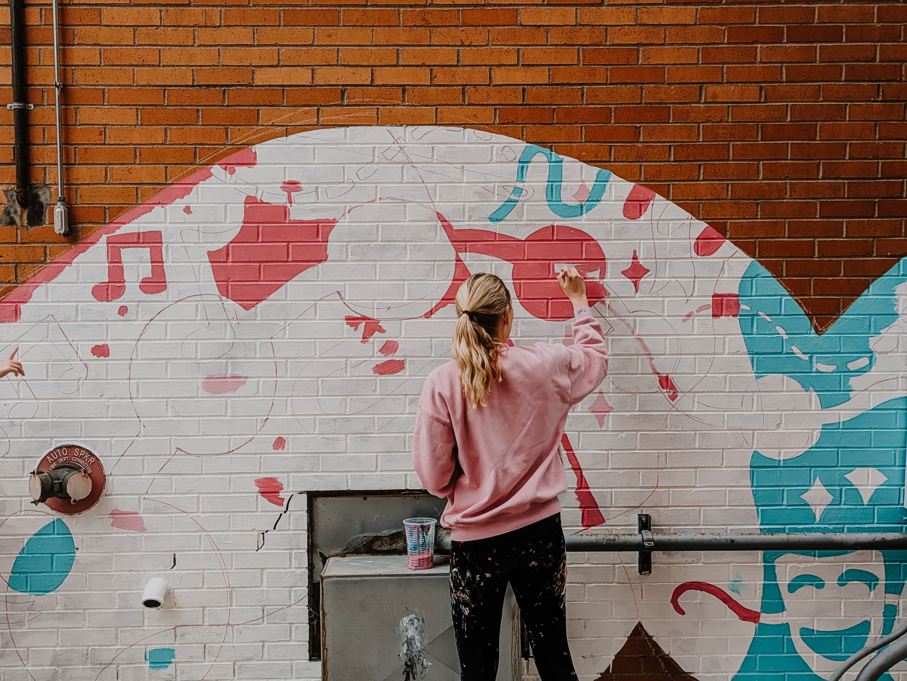 Ali painting the mural