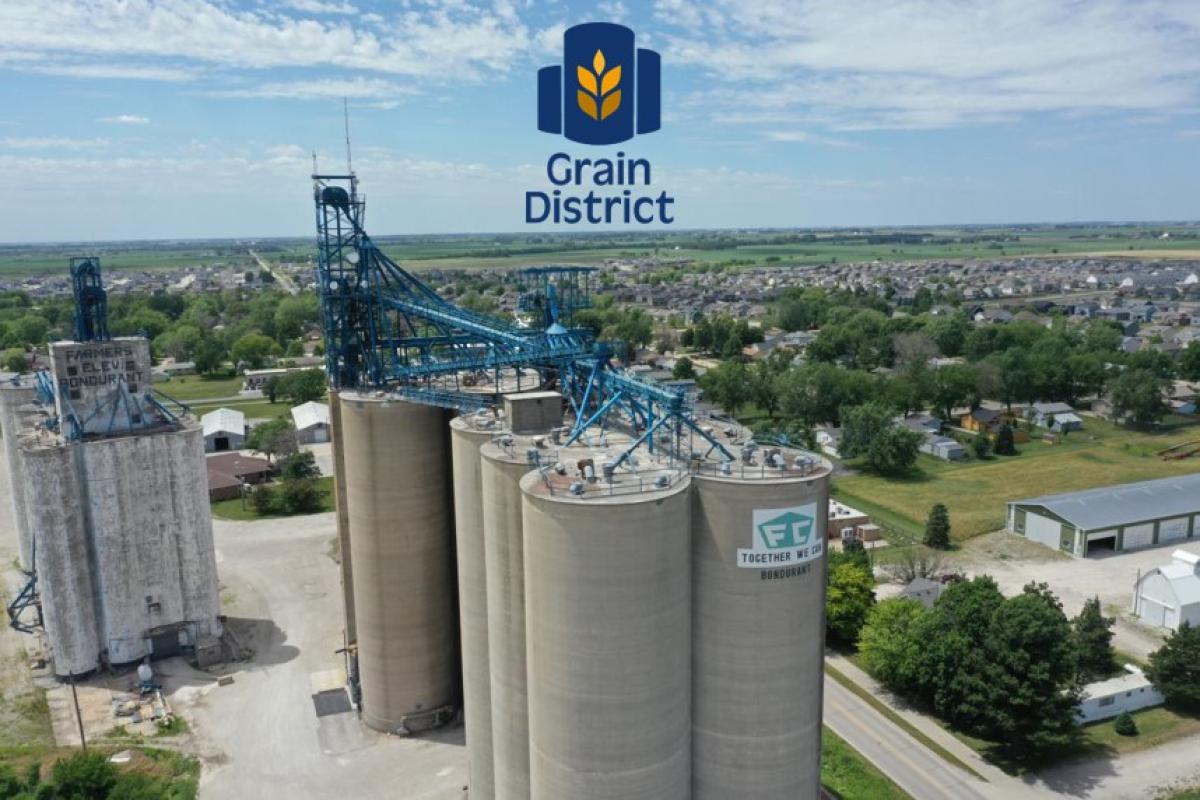 a photo of grain silos with the word Grain District on top
