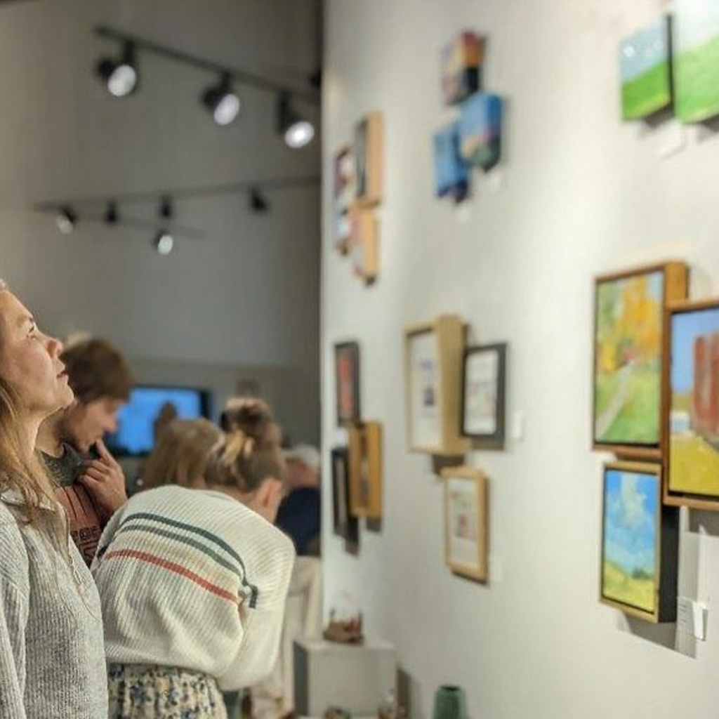 woman looking at art