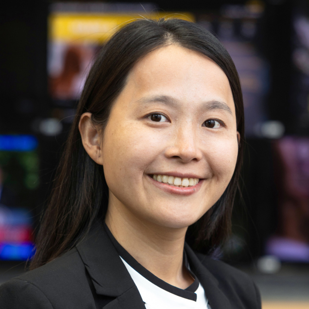 A headshot of a woman smiling