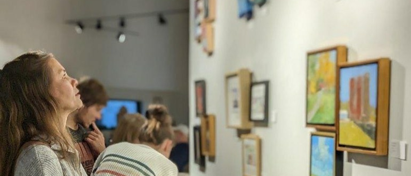 woman looking at art