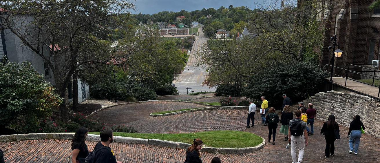 A group of UI students walking down Snake Alley in Burlington, Iowa