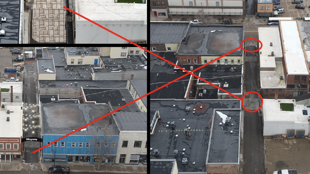 overhead photo of city streets with red arrows