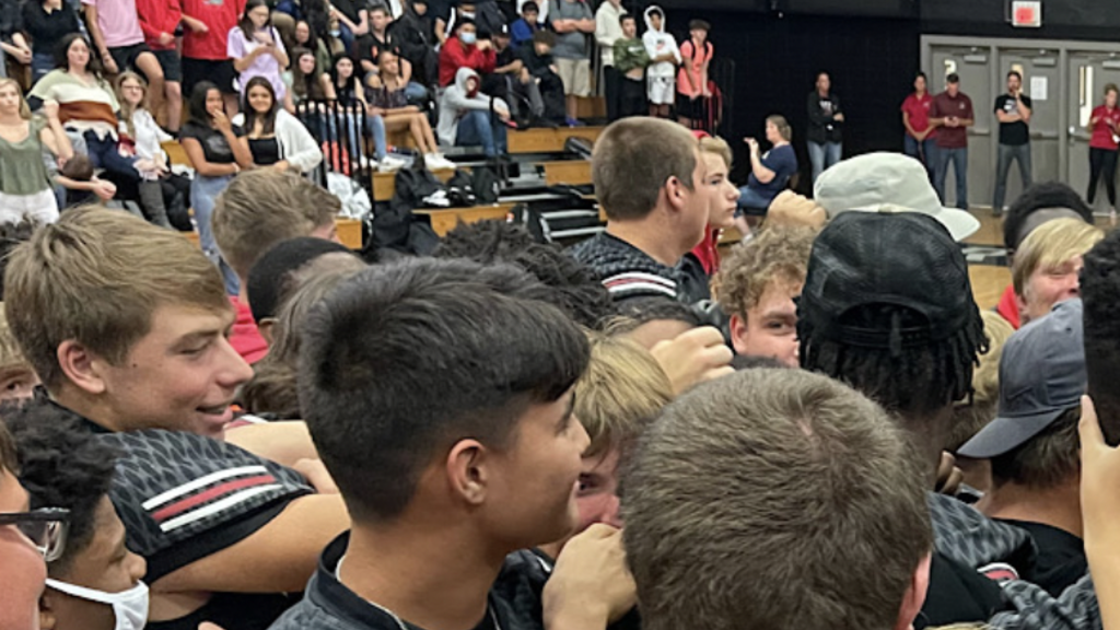 High school students in a gymnasium at a celebration