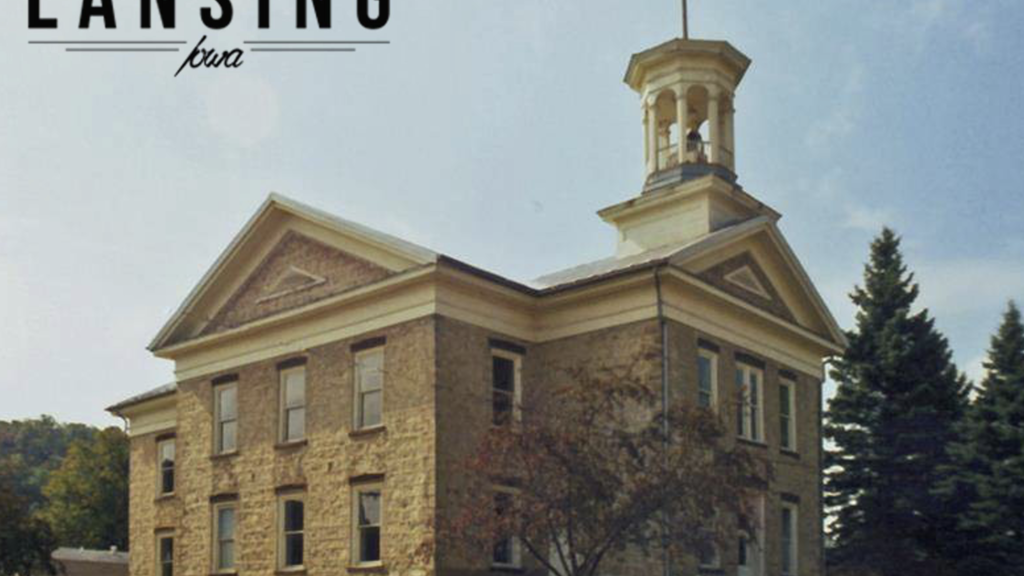 old limestone building with cupola and the title "Lansing"