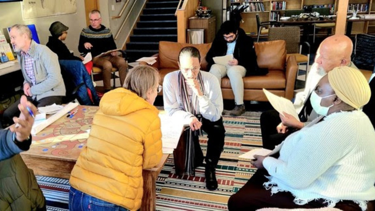 People working in small groups.